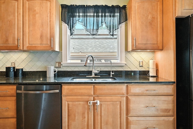 4 Hillcrest St, Waterville, ME 04901 - kitchen with stainless steel dishwasher, freestanding refrigerator, dark stone counters, and decorative backsplash