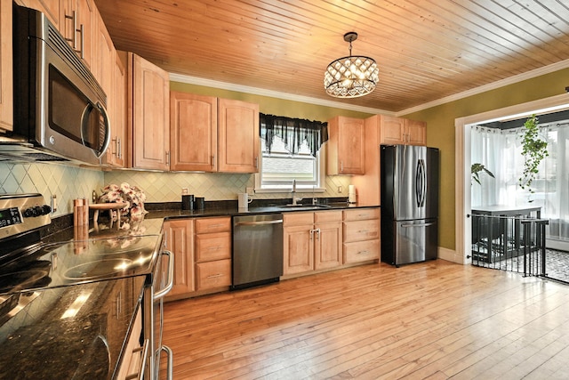 4 Hillcrest St, Waterville, ME 04901 - kitchen with appliances with stainless steel finishes, crown molding, a chandelier, decorative backsplash, and light wood-type flooring
