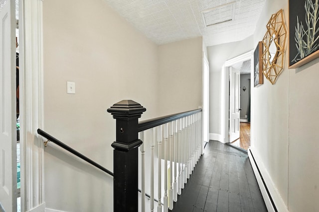 4 Hillcrest St, Waterville, ME 04901 - hall featuring an upstairs landing, dark wood-type flooring, and baseboard heating