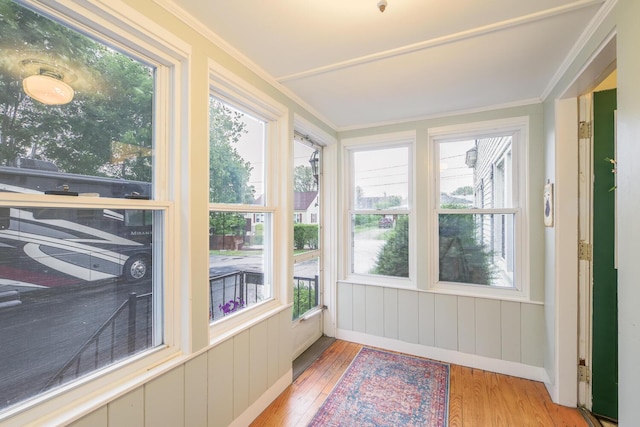 3 N Garand St, Winslow, ME 04901 - unfurnished sunroom featuring hardwood / wood-style floors, plenty of natural light, and crown molding