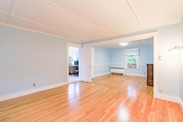 3 N Garand St, Winslow, ME 04901 - empty room with radiator, light wood finished floors, and cooling unit
