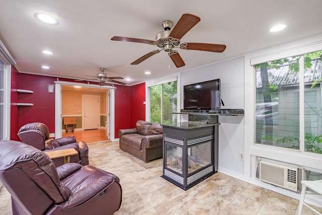 3 N Garand St, Winslow, ME 04901 - living area featuring healthy amount of natural light, recessed lighting, a multi sided fireplace, and ceiling fan