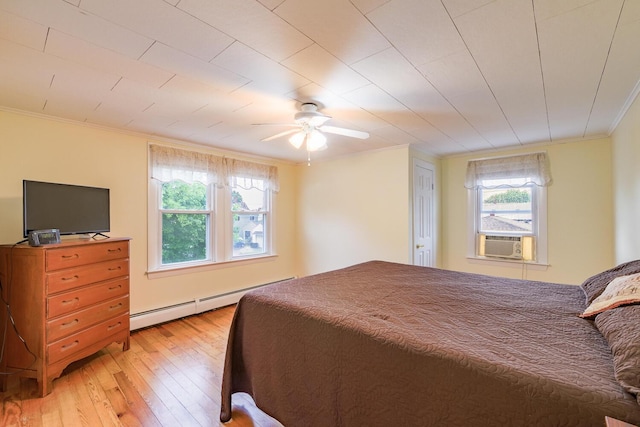 3 N Garand St, Winslow, ME 04901 - bedroom with a baseboard radiator, light wood-style floors, ornamental molding, a ceiling fan, and cooling unit