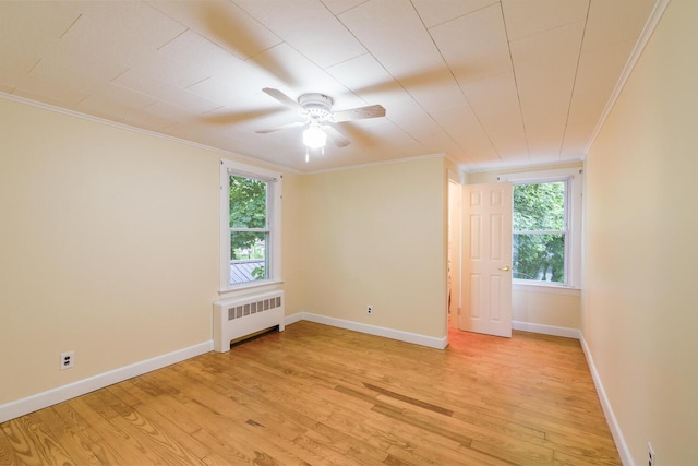 3 N Garand St, Winslow, ME 04901 - spare room with radiator heating unit, crown molding, light wood finished floors, and a ceiling fan