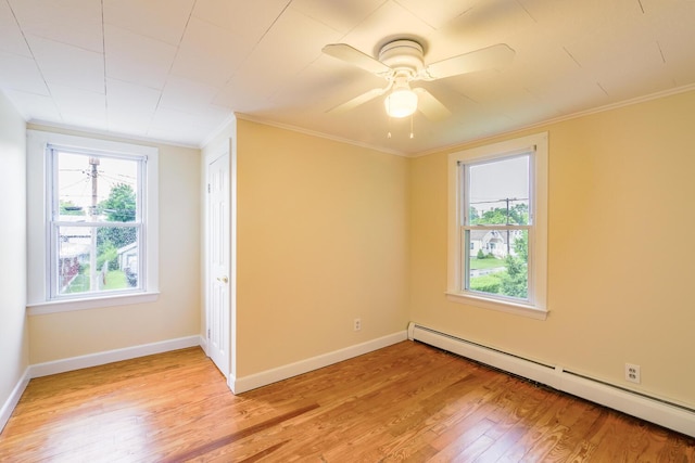 3 N Garand St, Winslow, ME 04901 - unfurnished bedroom with a baseboard radiator, light wood-style floors, ornamental molding, and ceiling fan