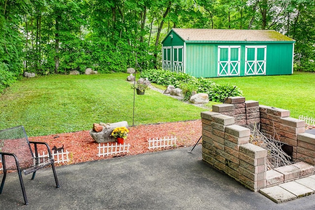 3 N Garand St, Winslow, ME 04901 - view of green lawn with an outdoor structure and a patio