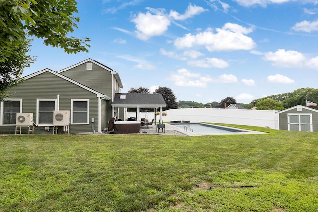 5 Fairview Ave, Auburn, ME 04210 - rear view of house with a storage shed, a fenced backyard, a patio area, and a hot tub