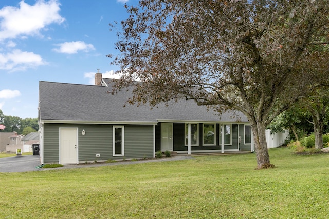 5 Fairview Ave, Auburn, ME 04210 - view of front facade with a shingled roof, a front yard, and a chimney
