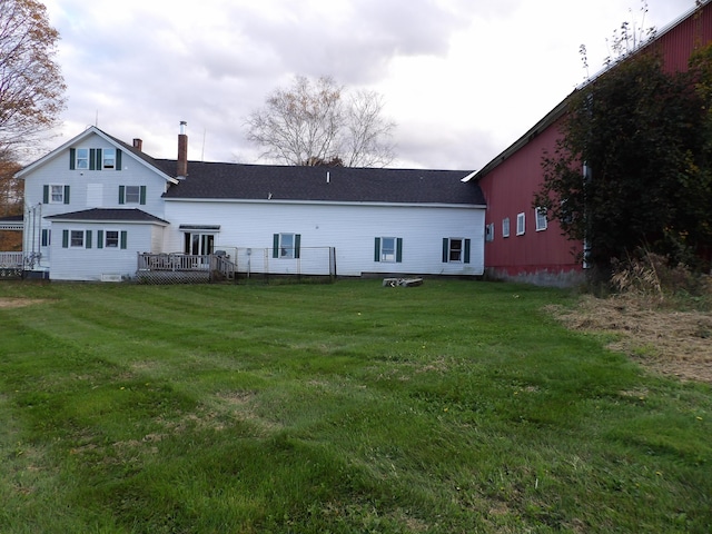 38 Atkinson Rd, Charleston, ME 04422 - back of house with a lawn, a chimney, and a deck
