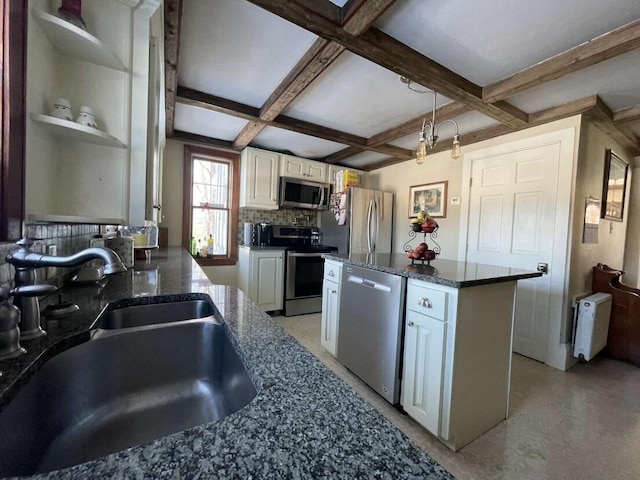 38 Atkinson Rd, Charleston, ME 04422 - kitchen with stainless steel appliances, coffered ceiling, tasteful backsplash, a kitchen island, and white cabinets