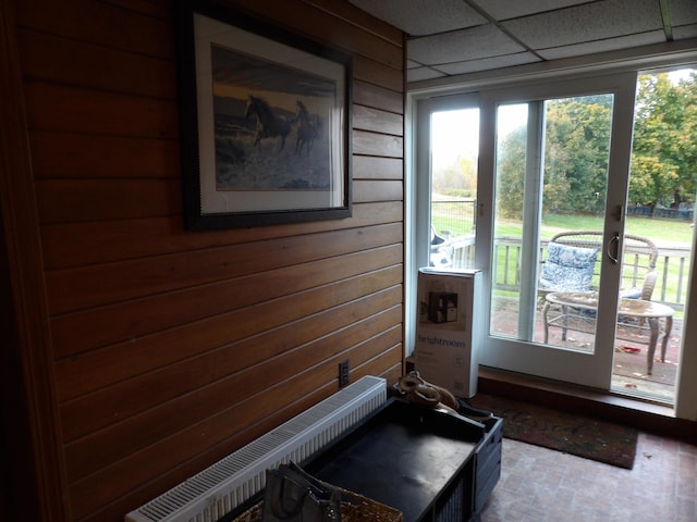 38 Atkinson Rd, Charleston, ME 04422 - entryway with wood walls and radiator heating unit