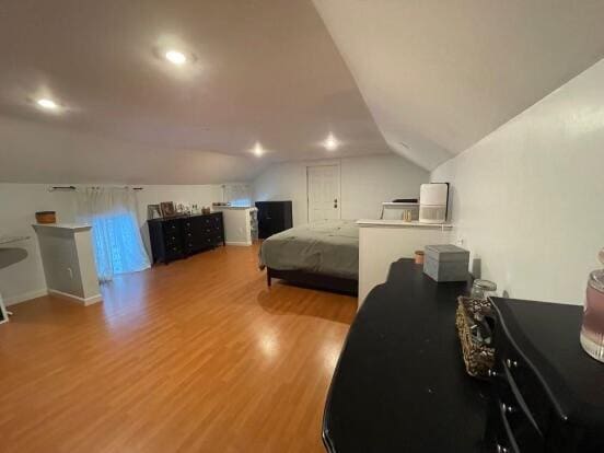 38 Atkinson Rd, Charleston, ME 04422 - bedroom with wood finished floors, vaulted ceiling, and recessed lighting