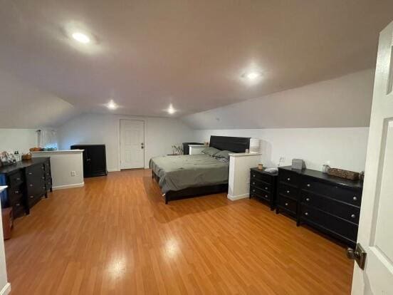 38 Atkinson Rd, Charleston, ME 04422 - bedroom featuring lofted ceiling, wood finished floors, and recessed lighting