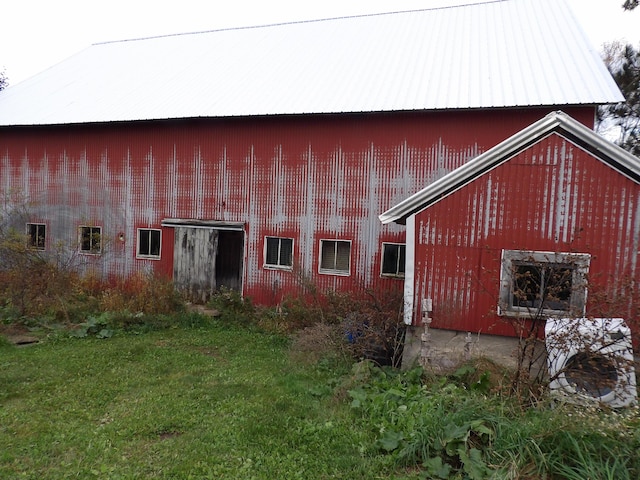 38 Atkinson Rd, Charleston, ME 04422 - back of house with a pole building, an outbuilding, and a metal roof