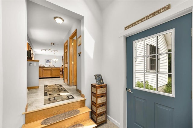 21 Bowling Green Ln, Belfast, ME 04915 - entrance foyer with light tile patterned floors and track lighting