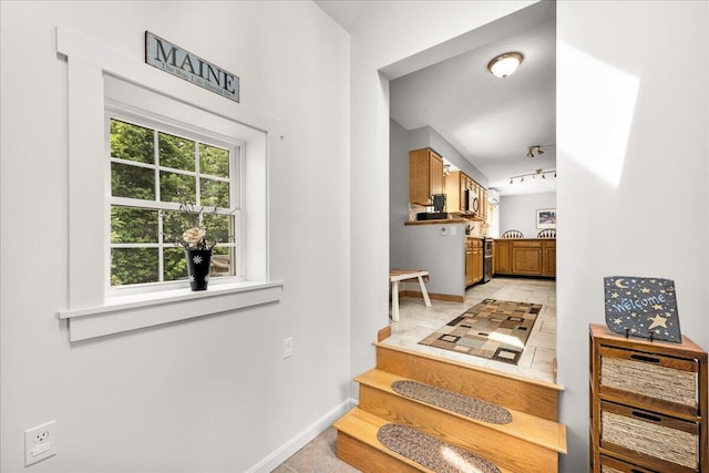 21 Bowling Green Ln, Belfast, ME 04915 - hall featuring light tile patterned floors and rail lighting