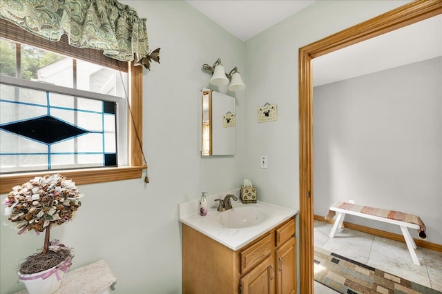 21 Bowling Green Ln, Belfast, ME 04915 - bathroom with vanity and baseboards