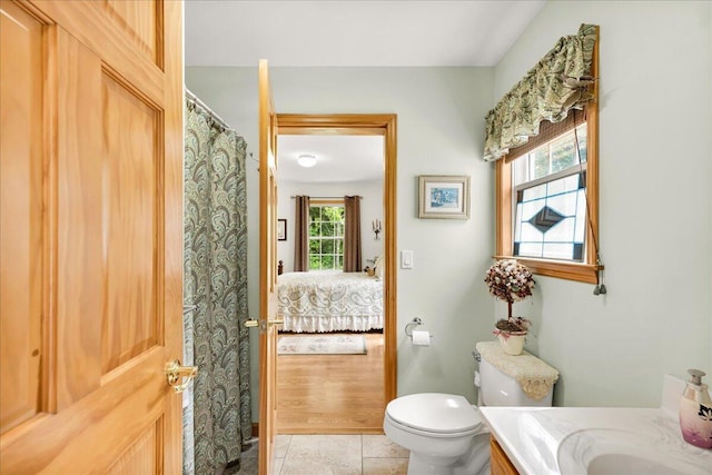 21 Bowling Green Ln, Belfast, ME 04915 - full bath featuring vanity, tile patterned floors, ensuite bathroom, and a shower with curtain