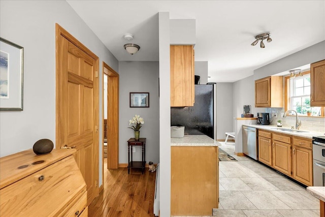 21 Bowling Green Ln, Belfast, ME 04915 - kitchen with appliances with stainless steel finishes and decorative backsplash
