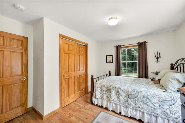 21 Bowling Green Ln, Belfast, ME 04915 - bedroom with light wood-style flooring and a closet