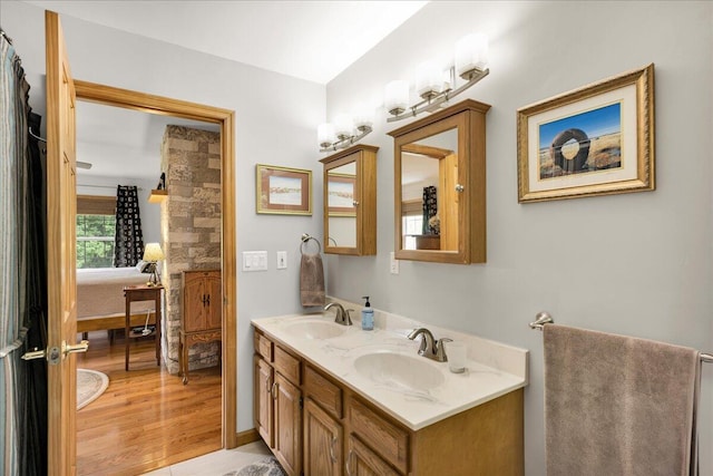 21 Bowling Green Ln, Belfast, ME 04915 - ensuite bathroom with double vanity and wood finished floors