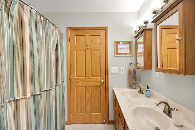 21 Bowling Green Ln, Belfast, ME 04915 - bathroom featuring double vanity and tile patterned flooring