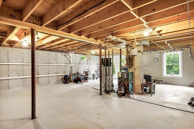 21 Bowling Green Ln, Belfast, ME 04915 - basement featuring water heater and a heating unit