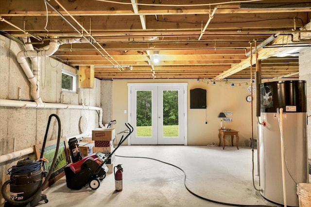 21 Bowling Green Ln, Belfast, ME 04915 - basement with water heater, healthy amount of natural light, and french doors