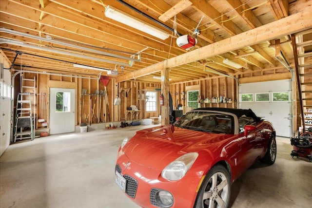 21 Bowling Green Ln, Belfast, ME 04915 - garage featuring a garage door opener