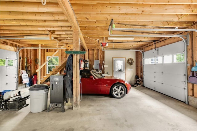 21 Bowling Green Ln, Belfast, ME 04915 - garage featuring a garage door opener and electric panel