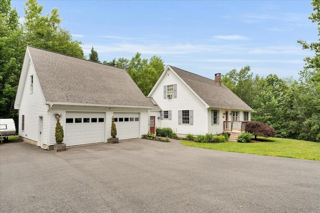 21 Bowling Green Ln, Belfast, ME 04915 - view of front of home featuring a chimney, a shingled roof, and a front lawn