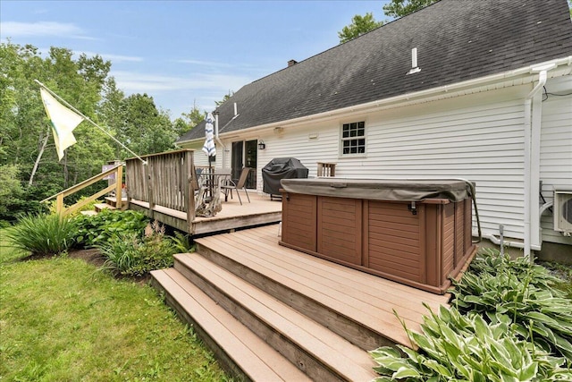 21 Bowling Green Ln, Belfast, ME 04915 - wooden deck with a hot tub, a grill, and outdoor dining space