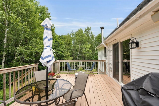 21 Bowling Green Ln, Belfast, ME 04915 - wooden terrace with outdoor dining space and grilling area