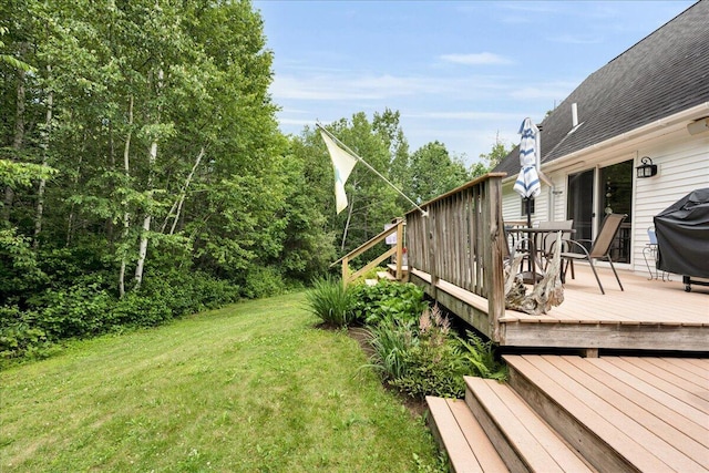 21 Bowling Green Ln, Belfast, ME 04915 - view of grassy yard featuring a deck and outdoor dining area