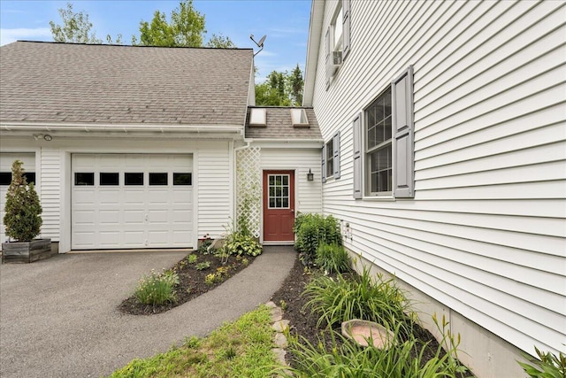 21 Bowling Green Ln, Belfast, ME 04915 - doorway to property with a garage, asphalt driveway, and roof with shingles