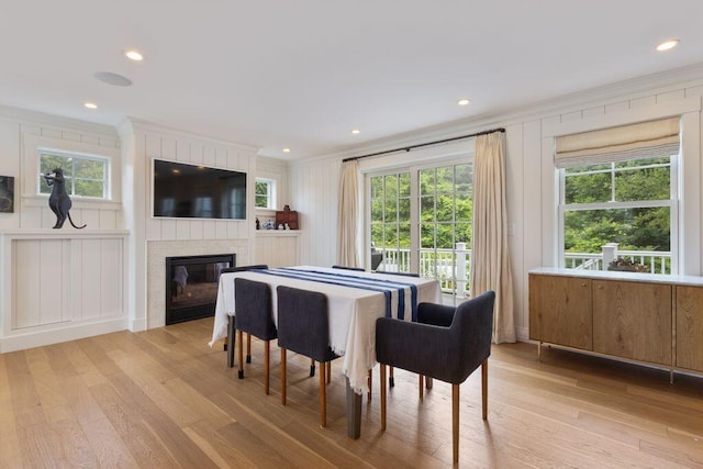 17 Intervale Rd, York, ME 03902 - dining area with crown molding, a fireplace, light wood-style flooring, healthy amount of natural light, and recessed lighting