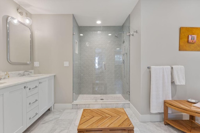 17 Intervale Rd, York, ME 03902 - bathroom with a shower stall, double vanity, and marble look tiles