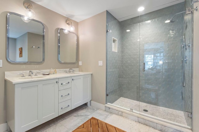 17 Intervale Rd, York, ME 03902 - bathroom featuring marble finish flooring, double vanity, and a shower stall