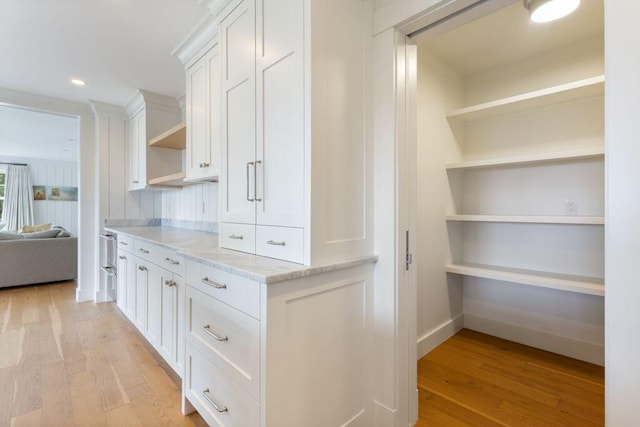 17 Intervale Rd, York, ME 03902 - kitchen with open shelves, light wood finished floors, light stone countertops, white cabinetry, and recessed lighting