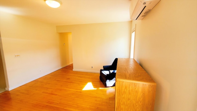 9 Wood St, Bangor, ME 04401 - unfurnished room with a wall unit AC and light wood finished floors