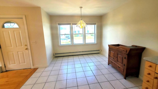 9 Wood St, Bangor, ME 04401 - foyer with a baseboard radiator, a chandelier, and light tile patterned floors