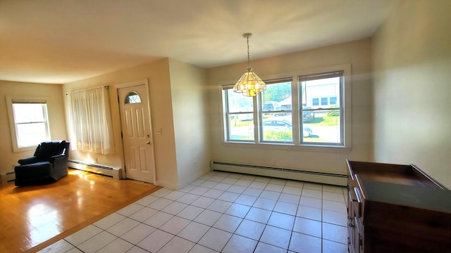 9 Wood St, Bangor, ME 04401 - foyer with baseboard heating, a chandelier, and light tile patterned flooring