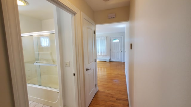 9 Wood St, Bangor, ME 04401 - hall featuring a baseboard heating unit and light wood-type flooring