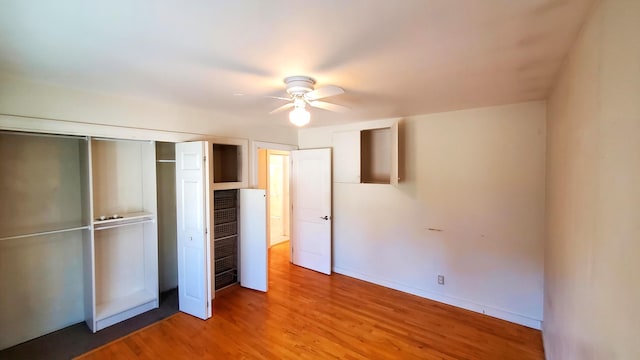 9 Wood St, Bangor, ME 04401 - unfurnished bedroom featuring light wood finished floors, a closet, and a ceiling fan