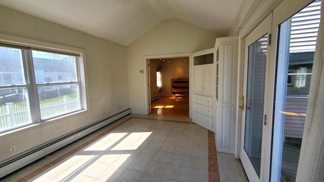 9 Wood St, Bangor, ME 04401 - empty room featuring a baseboard heating unit, healthy amount of natural light, lofted ceiling, a baseboard radiator, and light tile patterned floors
