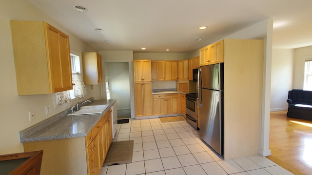 9 Wood St, Bangor, ME 04401 - kitchen featuring stainless steel appliances, light brown cabinets, light tile patterned flooring, and recessed lighting