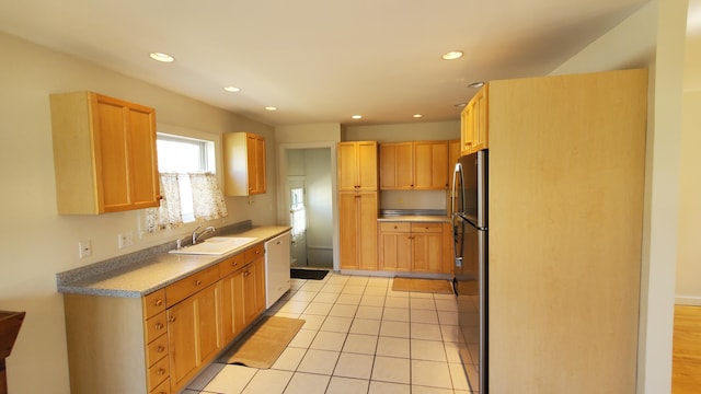 9 Wood St, Bangor, ME 04401 - kitchen featuring freestanding refrigerator, white dishwasher, recessed lighting, light tile patterned floors, and light brown cabinetry