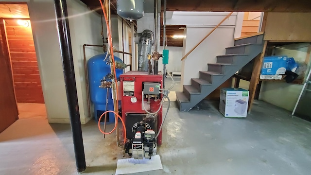 9 Wood St, Bangor, ME 04401 - unfinished basement featuring a water pressure tank, stairway, and a heating unit