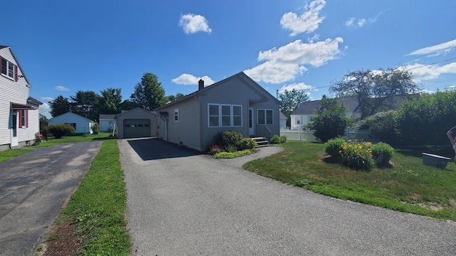 9 Wood St, Bangor, ME 04401 - bungalow with an outbuilding, driveway, a chimney, and a detached garage