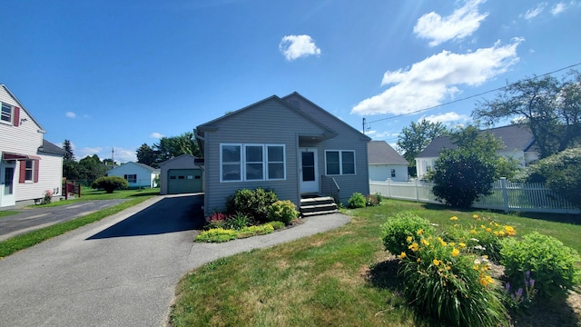 9 Wood St, Bangor, ME 04401 - view of front of home with a garage, an outbuilding, and driveway